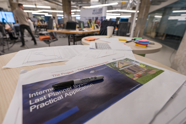 A sharpie sits on top of a printed-out version of 