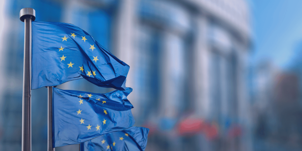 European flags with a blurred background behind.